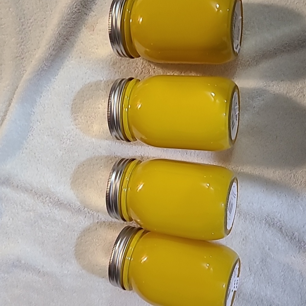 4 yellow mason jars with lids